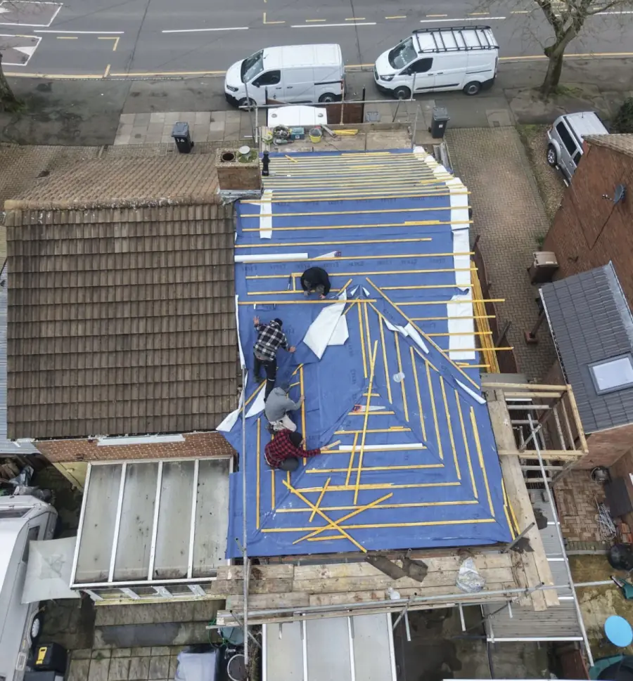 Expert Roofing Services team fitting membrane and battens on a new roof